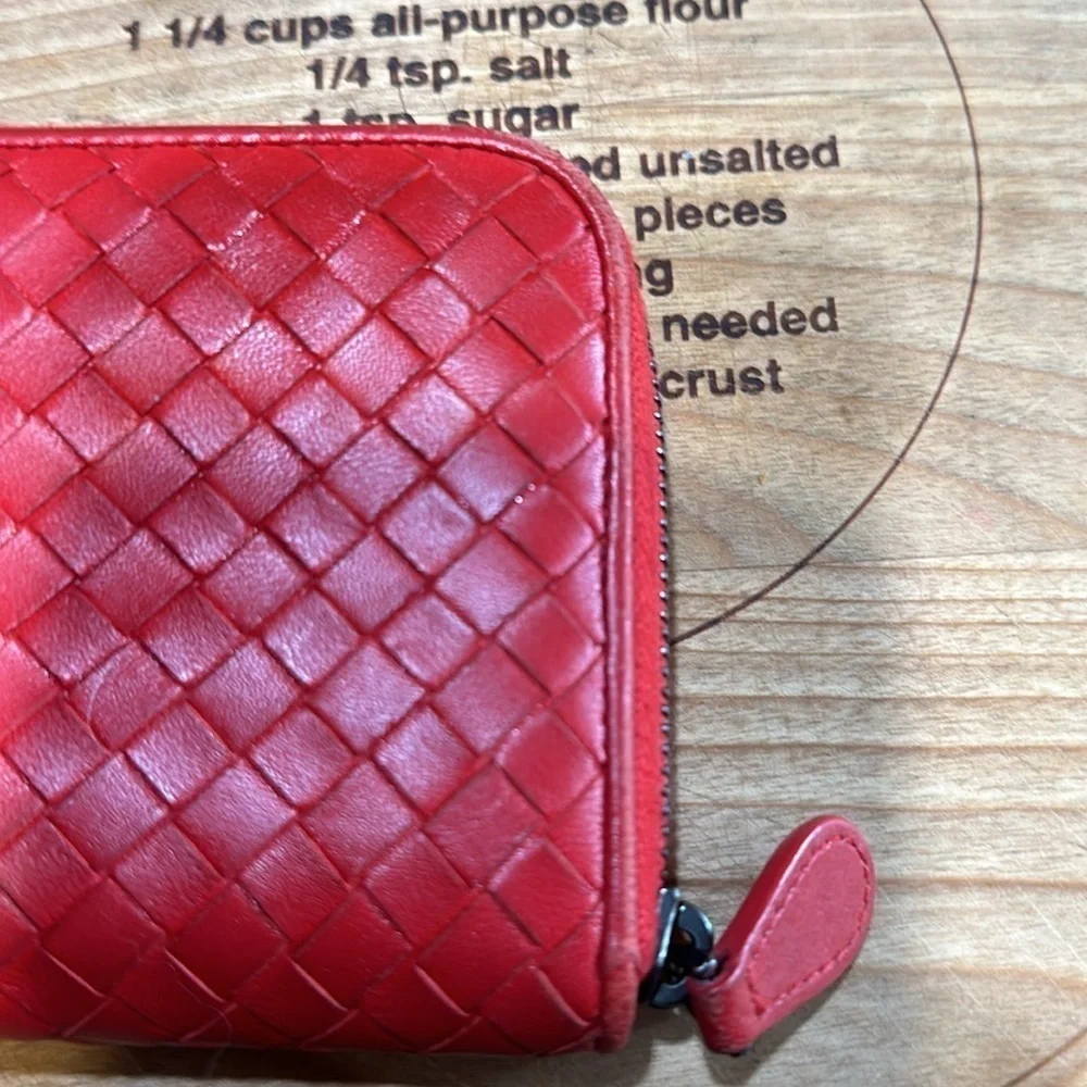 Bottega Veneta red wallet.